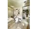 Nicely appointed bathroom leads into primary bedroom with decorative bed at 717 Chatter Rd, Mount Pleasant, SC 29464