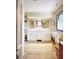 A bright bathroom features double sink vanities with a large decorative rug at 717 Chatter Rd, Mount Pleasant, SC 29464