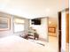 Comfortable attic bedroom featuring artwork, television, and natural light at 717 Chatter Rd, Mount Pleasant, SC 29464