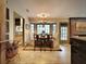 Bright breakfast nook features a charming chandelier, bay windows, and stylish seating, perfect for casual dining at 717 Chatter Rd, Mount Pleasant, SC 29464