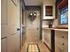 Bright hallway featuring white cabinetry, a decorative wreath, and a charming patterned rug, creating a welcoming space at 717 Chatter Rd, Mount Pleasant, SC 29464