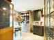 Well-appointed kitchen showcases a vintage cabinet, a decorative floral arrangement, and a charming, light-filled ambiance at 717 Chatter Rd, Mount Pleasant, SC 29464