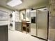 Well-equipped laundry area with sink, stainless steel refrigerator and stylish storage for a functional and modern home at 717 Chatter Rd, Mount Pleasant, SC 29464