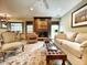 Bright living room features a cozy fireplace, refined seating, and decorative area rug at 717 Chatter Rd, Mount Pleasant, SC 29464