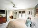 Bright bedroom with king bed, french doors, and wood dresser at 717 Chatter Rd, Mount Pleasant, SC 29464