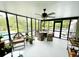 Bright sunroom with floor-to-ceiling windows, ceiling fan and comfortable seating, perfect for relaxing or entertaining at 717 Chatter Rd, Mount Pleasant, SC 29464
