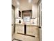 A charming wet bar area features white cabinetry, a tiled backsplash, and a window for natural light at 717 Chatter Rd, Mount Pleasant, SC 29464