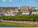 Charming cityscape featuring historic buildings with mature trees and a waterfront view on a sunny day at 8 Prioleau St # Th A, Charleston, SC 29401