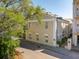 Exterior shot of a multi-story building, showcasing architectural details and surrounding greenery at 8 Prioleau St # Th A, Charleston, SC 29401