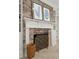 Charming brick fireplace with a decorative mantel, built-in shelving, and elegant accents at 8 Prioleau St # Th A, Charleston, SC 29401