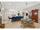 Open-concept kitchen with a large island, bar seating, and adjacent dining area at 8 Prioleau St # Th A, Charleston, SC 29401