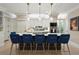 Stylish kitchen island with a cooktop, bar seating, and modern pendant lighting at 8 Prioleau St # Th A, Charleston, SC 29401