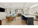Spacious kitchen featuring modern appliances, a large island with seating, and stylish dining area at 8 Prioleau St # Th A, Charleston, SC 29401