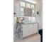 Chic wet bar with granite countertops, custom cabinetry, and stylish wine storage at 8 Prioleau St # Th A, Charleston, SC 29401