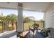 Relax on the balcony with views of the grounds, mature palms, and beach at 8000 Palmetto Dr # 104-A, Isle of Palms, SC 29451