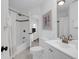 Bright bathroom with walk-in shower and white vanity at 8000 Palmetto Dr # 104-A, Isle of Palms, SC 29451
