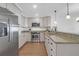 Modern kitchen featuring stainless steel appliances, granite countertops, and ample cabinet space at 8000 Palmetto Dr # 104-A, Isle of Palms, SC 29451
