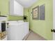 Tidy laundry area with a washer, dryer, and neutral paint at 8000 Palmetto Dr # 104-A, Isle of Palms, SC 29451