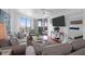 Cozy living room with comfortable sofas, a large TV, and access to an outdoor balcony at 8000 Palmetto Dr # 104-A, Isle of Palms, SC 29451
