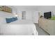 Bright bedroom suite features an ensuite bathroom and white, neutral paint at 8000 Palmetto Dr # 104-A, Isle of Palms, SC 29451