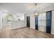 Open dining area featuring wood-look floors, modern lighting and easy access to the kitchen at 8624 Grassy Oak Trl, North Charleston, SC 29420