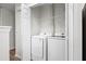 Convenient laundry room featuring a new white washer and dryer with built in storage at 8624 Grassy Oak Trl, North Charleston, SC 29420