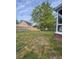 Spacious backyard with a large tree providing ample shade at 8701 Caspiana Ln, North Charleston, SC 29420