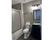 Bathroom with sliding glass shower door and vanity sink at 8701 Caspiana Ln, North Charleston, SC 29420