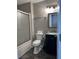 Bathroom with sliding glass shower door and vanity sink at 8701 Caspiana Ln, North Charleston, SC 29420