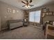 Charming Bedroom featuring a gray crib, themed decor, and natural light, creating a cozy space at 8701 Caspiana Ln, North Charleston, SC 29420