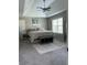 This bedroom offers a large bed, a ceiling fan and plenty of natural light at 8701 Caspiana Ln, North Charleston, SC 29420