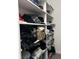 This walk-in closet offers shelves, rods, and space for personal belongings at 8701 Caspiana Ln, North Charleston, SC 29420