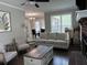 Cozy living room area with a fireplace, plush seating, and open flow to the kitchen and dining areas at 8701 Caspiana Ln, North Charleston, SC 29420
