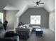 Open living room with vaulted ceilings, a sectional sofa, natural light, and plenty of space at 8701 Caspiana Ln, North Charleston, SC 29420