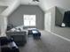Spacious living area with a sectional sofa, plush seating, and natural light from the window at 8701 Caspiana Ln, North Charleston, SC 29420
