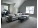 Large living room featuring a sectional couch, office desk with a computer and natural light at 8701 Caspiana Ln, North Charleston, SC 29420