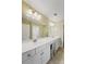 Bathroom boasting a double sink vanity with white cabinets and a large mirror with accent lighting at 8800 Dorchester Rd # 4001, North Charleston, SC 29420