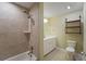 Bathroom features a tub-shower combo and a neutral tile shower with vanity at 8800 Dorchester Rd # 4001, North Charleston, SC 29420