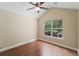 Bedroom with laminate flooring, a vaulted ceiling, a ceiling fan, and a large window at 8800 Dorchester Rd # 4001, North Charleston, SC 29420
