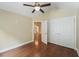 Spacious bedroom with wood-look floors, ceiling fan, and large closet, creating a relaxing retreat at 8800 Dorchester Rd # 4001, North Charleston, SC 29420