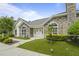 Beautiful home featuring stone accents and manicured artificial turf, providing an inviting entrance at 8800 Dorchester Rd # 4001, North Charleston, SC 29420