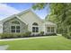 Charming one-story house featuring large windows and a well-maintained lawn, creating a welcoming atmosphere at 8800 Dorchester Rd # 4001, North Charleston, SC 29420