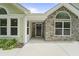 Inviting entrance showcasing a combination of siding and stone, with well-maintained landscaping at 8800 Dorchester Rd # 4001, North Charleston, SC 29420