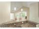 Granite counters and a stainless steel sink are shown in this view of the kitchen at 8800 Dorchester Rd # 4001, North Charleston, SC 29420