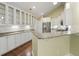 Bright kitchen featuring granite countertops, white cabinets with glass doors, and modern stainless-steel appliances at 8800 Dorchester Rd # 4001, North Charleston, SC 29420