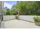 Fenced patio area with concrete surface and an umbrella, providing a cozy outdoor space at 8800 Dorchester Rd # 4001, North Charleston, SC 29420