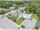 Aerial view of the community pool with lounge chairs, landscaped grounds, and nearby parking at 8800 Dorchester Rd # 4001, North Charleston, SC 29420