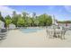 Community pool with lounge chairs and tables perfect for a relaxing afternoon at 8800 Dorchester Rd # 4001, North Charleston, SC 29420