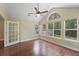Bright sunroom with large windows offering outdoor views, vaulted ceiling, and beautiful wood-look flooring at 8800 Dorchester Rd # 4001, North Charleston, SC 29420