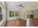 Bright sunroom with large windows, hardwood floors, and a ceiling fan, providing plenty of natural light at 8800 Dorchester Rd # 4001, North Charleston, SC 29420
